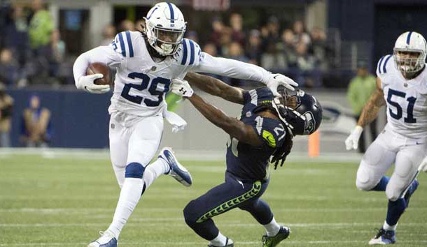 Oct 1, 2017; Seattle, WA, USA; Indianapolis Colts free safety Malik Hooker (29) stiff arms Seattle Seahawks cornerback DeAndre Elliott (21) as he runs back an interception during the second half at CenturyLink Field. The Seahawks won 46-18. Photo Credit: Troy Wayrynen-USA TODAY Sports