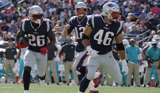 Sep 30, 2018; Foxborough, MA, USA; New England Patriots running back Sony Michel (26) runs the ball against the Miami Dolphins in the first half at Gillette Stadium. Photo Credit: David Butler II-USA TODAY Sports