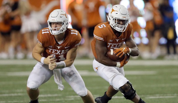 Sep 8, 2018; Austin, TX, USA; University of Texas Longhorns quarterback Sam Ehlinger (11) hands the ball to running back Tre Watson (5) in the 1st half against University of Tulsa Golden Hurricane at Darrell K Royal-Texas Memorial Stadium. Photo Credit: Jamie Harms-USA TODAY Sports