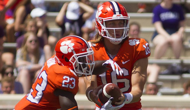 Sep 1, 2018; Clemson, SC, USA; Clemson Tigers quarterback Trevor Lawrence (16) hands the ball off to Clemson Tigers running back Lyn-J Dixon (23) during the third quarter at Clemson Memorial Stadium. Photo Credit: Joshua S. Kelly-USA TODAY Sports