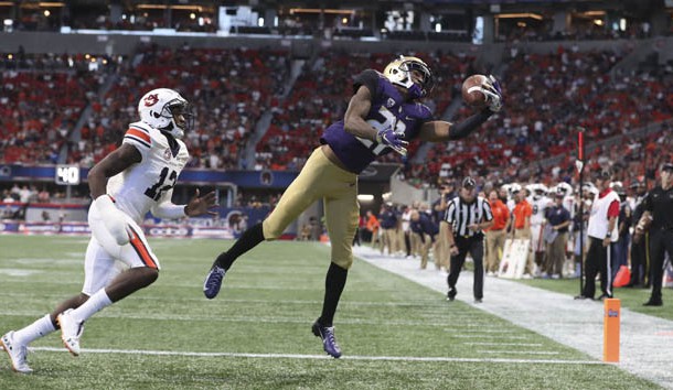 Sep 1, 2018; Atlanta, GA, USA; Washington Huskies wide receiver Quinten Pounds (21) makes a touchdown catch against Auburn Tigers defensive back Jamel Dean (12) in the second quarter at Mercedes-Benz Stadium. Photo Credit: Jason Getz-USA TODAY Sports