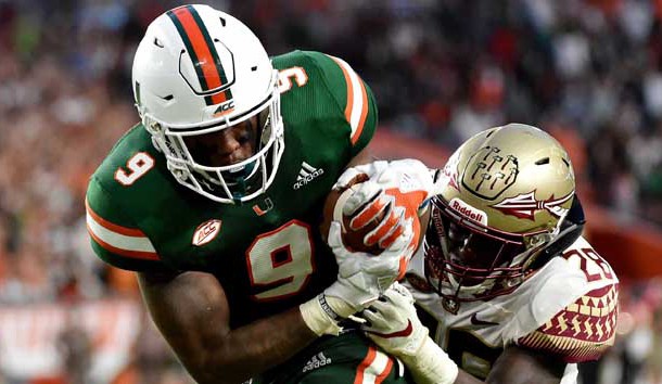 Oct 6, 2018; Miami Gardens, FL, USA; Miami Hurricanes tight end Brevin Jordan (9) runs in a touchdown as Florida State Seminoles linebacker DeCalon Brooks (28) defends the play during the second half at Hard Rock Stadium. Photo Credit: Steve Mitchell-USA TODAY Sports