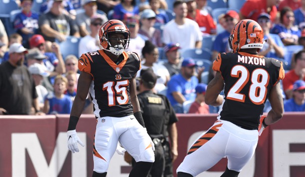 Aug 26, 2018; Orchard Park, NY, USA; Cincinnati Bengals wide receiver John Ross (15) celebrates scoring a touchdown as running back Joe Mixon (28) joins in during the first quarter of a game against the Buffalo Bills at New Era Field. Photo Credit: Mark Konezny-USA TODAY Sports
