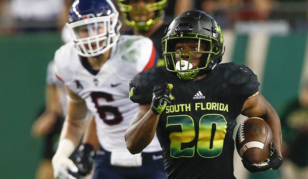 Oct 20, 2018; Tampa, FL, USA; South Florida Bulls running back Johnny Ford (20) runs for a touchdown as Connecticut Huskies linebacker Eddie Hahn (6) defends during the second half at Raymond James Stadium. Photo Credit: Reinhold Matay-USA TODAY Sports