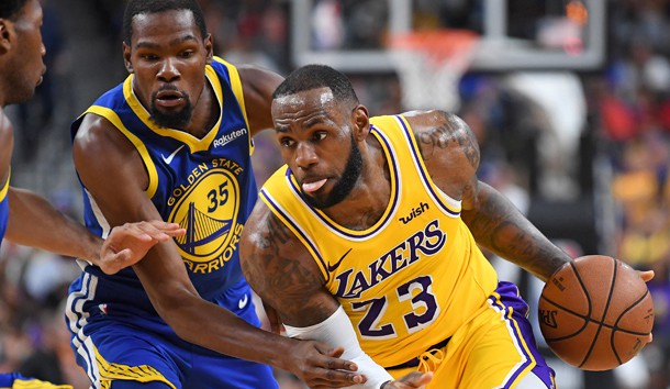 Oct 10, 2018; Las Vegas, NV, USA; Los Angeles Lakers forward LeBron James (23) dribbles against the defense of Golden State Warriors forward Kevin Durant (35) during the first half at T-Mobile Arena. Photo Credit: Stephen R. Sylvanie-USA TODAY Sports
