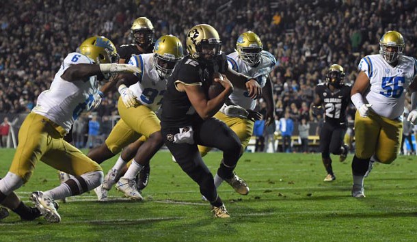 Sep 28, 2018; Boulder, CO, USA; Colorado Buffaloes quarterback Steven Montez (12) carries for a touchdown in the first half at Folsom Field. Photo Credit: Ron Chenoy-USA TODAY Sports