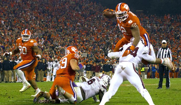 Nov 24, 2018; Clemson, SC, USA; Clemson Tigers defensive lineman Christian Wilkins (42) hurtles South Carolina Gamecocks linebacker Sherrod Greene (44) during the second quarter of the game to score a touchdown at Clemson Memorial Stadium. Photo Credit: Joshua S. Kelly-USA TODAY Sports