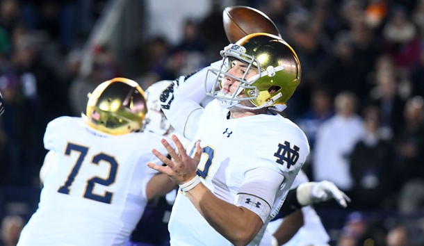 Nov 3, 2018; Evanston, IL, USA; Notre Dame Fighting Irish quarterback Ian Book (12) drop back top pass against the Northwestern Wildcats during the first quarter at Ryan Field. Photo Credit: Mike DiNovo-USA TODAY Sports