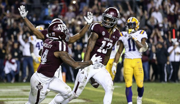 Nov 24, 2018; College Station, TX, USA; Texas A&M Aggies wide receiver Kendrick Rogers (13) celebrates with wide receiver Camron Buckley (14) after making a reception on a two-point conversion in the seventh overtime to defeat the LSU Tigers at Kyle Field. Photo Credit: Troy Taormina-USA TODAY Sports