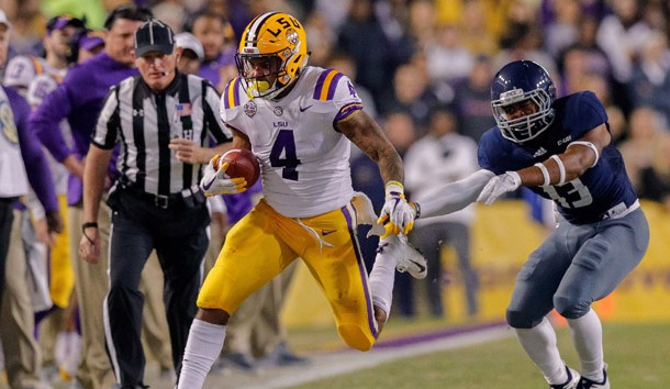 Nov 17, 2018; Baton Rouge, LA, USA; Rice Owls running back Collin Whitaker (13) pushes LSU Tigers running back Nick Brossette (4) out of bounds in the first quarter at Tiger Stadium. Photo Credit: Stephen Lew-USA TODAY Sports