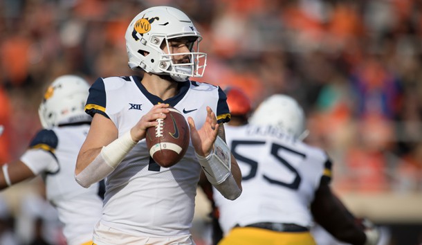 Nov 17, 2018; Stillwater, OK, USA; West Virginia Mountaineers quarterback Will Grier (7) looks to pass against the Oklahoma State Cowboys during the first quarter at Boone Pickens Stadium. Photo Credit: Rob Ferguson-USA TODAY Sports