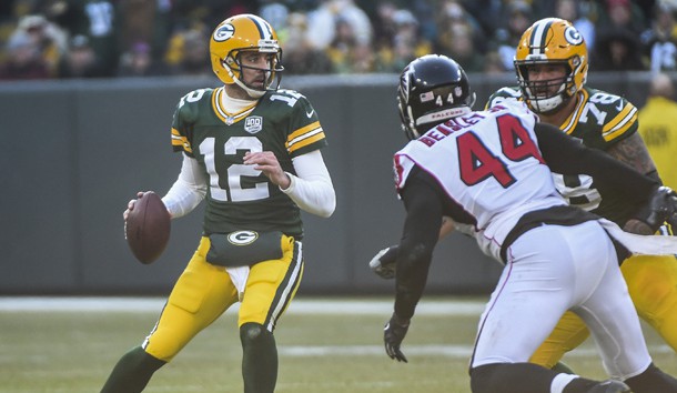 Dec 9, 2018; Green Bay, WI, USA; Green Bay Packers quarterback Aaron Rodgers (12) looks to pass while under pressure from Atlanta Falcons linebacker Vic Beasley Jr. (44) in the second quarter at Lambeau Field. Photo Credit: Benny Sieu-USA TODAY Sports