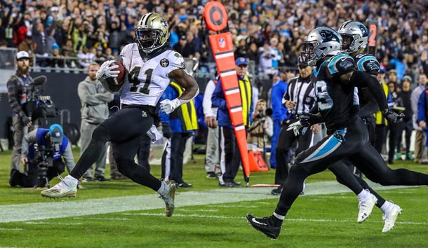Dec 17, 2018; Charlotte, NC, USA; New Orleans Saints running back Alvin Kamara (41) runs into the end zone past Carolina Panthers free safety Mike Adams (29) during the second half at Bank of America Stadium. Photo Credit: Jim Dedmon-USA TODAY Sports