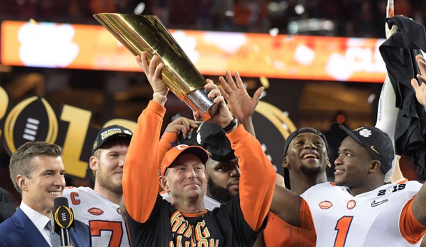 Jan 7, 2019; Santa Clara, CA, USA; Clemson Tigers head coach Dabo Swinney celebrates with the College Football Playoff National Championship trophy on the podium after defeating the Alabama Crimson Tide in the 2019 College Football Playoff Championship game at Levi's Stadium. Photo Credit: Kirby Lee-USA TODAY Sports