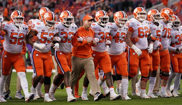 Jan 7, 2019; Santa Clara, CA, USA; Clemson Tigers head coach Dabo Swinney locks arms with his team before the 2019 College Football Playoff Championship game against the Alabama Crimson Tide at Levi's Stadium. Photo Credit: Kyle Terada-USA TODAY Sports