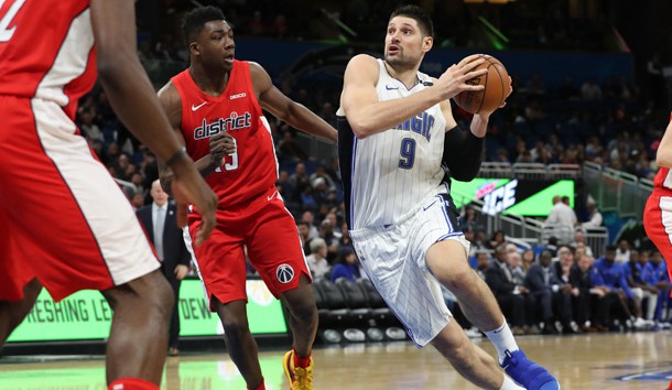 Jan 25, 2019; Orlando, FL, USA; Orlando Magic center Nikola Vucevic (9) drives to the basket as Washington Wizards center Thomas Bryant (13) defends during the second half at Amway Center. Photo Credit: Kim Klement-USA TODAY Sports