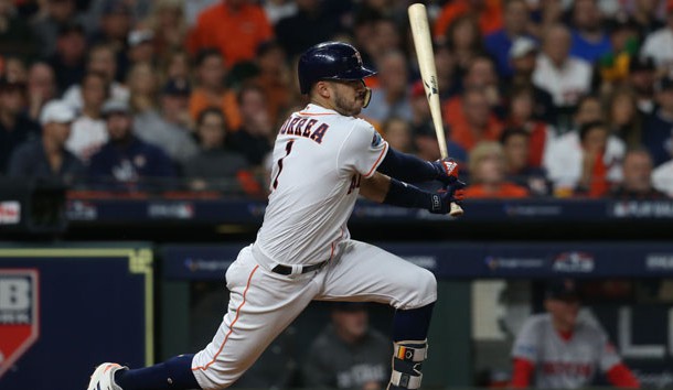 Oct 17, 2018; Houston, TX, USA; Houston Astros shortstop Carlos Correa (1) hits a RBI single in the second inning against the Boston Red Sox in game four of the 2018 ALCS playoff baseball series at Minute Maid Park. Photo Credit: Thomas B. Shea-USA TODAY Sports