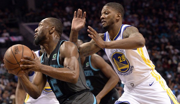Feb 25, 2019; Charlotte, NC, USA; Charlotte Hornets guard Kemba Walker (15) drives past Golden State Warriors forward Alfonzo McKinnie (28) during the second half at the Spectrum Center. Warriors won 121-110. Photo Credit: Sam Sharpe-USA TODAY Sports