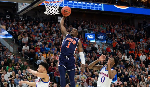 Mar 23, 2019; Salt Lake City, UT, USA; Auburn Tigers guard Jared Harper (1) goes up for a basket ahead of Kansas Jayhawks guard Marcus Garrett (0) during the first half in the second round of the 2019 NCAA Tournament at Vivint Smart Home Arena. Photo Credit: Gary A. Vasquez-USA TODAY Sports