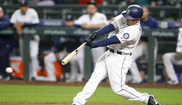 Sep 25, 2018; Seattle, WA, USA; Seattle Mariners third baseman Kyle Seager (15) hits an RBI-single against the Oakland Athletics during the ninth inning at Safeco Field. Photo Credit: Joe Nicholson-USA TODAY Sports