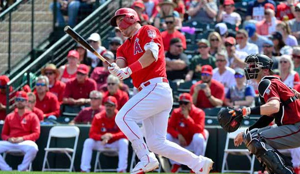 Mar 15, 2019; Tempe, AZ, USA; Los Angeles Angels center fielder Mike Trout (27) singles in the first inning against the Arizona Diamondbacks at Tempe Diablo Stadium. Photo Credit: Matt Kartozian-USA TODAY Sports
