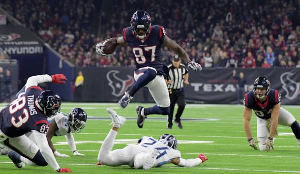 Nov 26, 2018; Houston, TX, USA; Houston Texans wide receiver Demaryius Thomas (87) leaps over Tennessee Titans strong safety Kenny Vaccaro (24) during the first half at NRG Stadium. Photo Credit: Kirby Lee-USA TODAY Sports