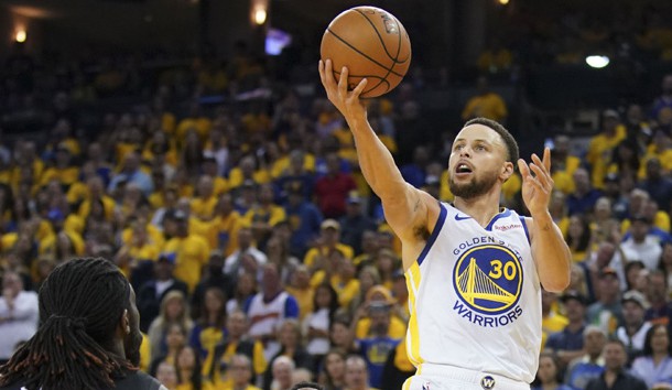 April 13, 2019; Oakland, CA, USA; Golden State Warriors guard Stephen Curry (30) shoots the basketball against LA Clippers forward Montrezl Harrell (5) during the fourth quarter in game one of the first round of the 2019 NBA Playoffs at Oracle Arena. Photo Credit: Kyle Terada-USA TODAY Sports