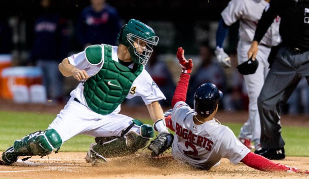 Apr 1, 2019; Oakland, CA, USA; Oakland Athletics catcher Nick Hundley (3) tags Boston Red Sox shortstop Xander Bogaerts (2) in a contested call that was upheld in the second inning at Oakland Coliseum. Photo Credit: John Hefti-USA TODAY Sports