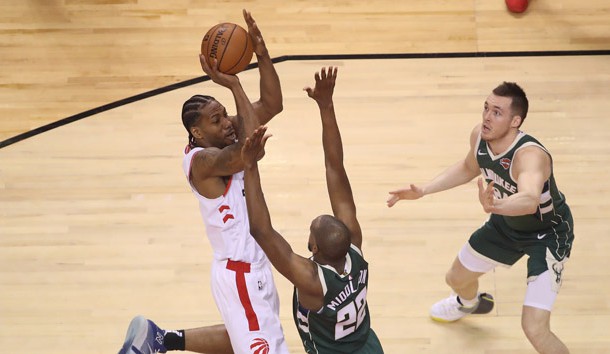 May 19, 2019; Toronto, Ontario, CAN; Toronto Raptors forward Kawhi Leonard (2) shoots the ball in the second quarter as Milwaukee Bucks forward Khris Middleton (22) defends in game three of the Eastern conference finals of the 2019 NBA Playoffs at Scotiabank Arena. Photo Credit: Tom Szczerbowski-USA TODAY Sports