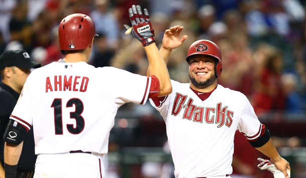 Diamondbacks catcher Welington Castillo (right) celebrates after scoring in the eighth inning with teammate Nick Ahmed against the Los Angeles Dodgers at Chase Field. Mark J. Rebilas-USA TODAY Sports