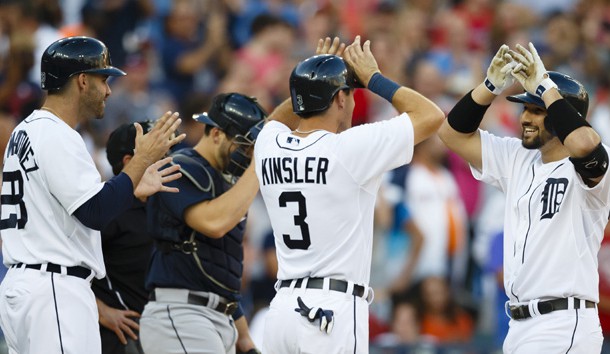 Jul 22, 2015; Detroit, MI, USA; Detroit Tigers third baseman Nick Castellanos (9) celebrates with second baseman Ian Kinsler (3) and right fielder J.D. Martinez (28) after hitting a grand slam in the third inning against the Seattle Mariners at Comerica Park. Mandatory Credit: Rick Osentoski-USA TODAY Sports