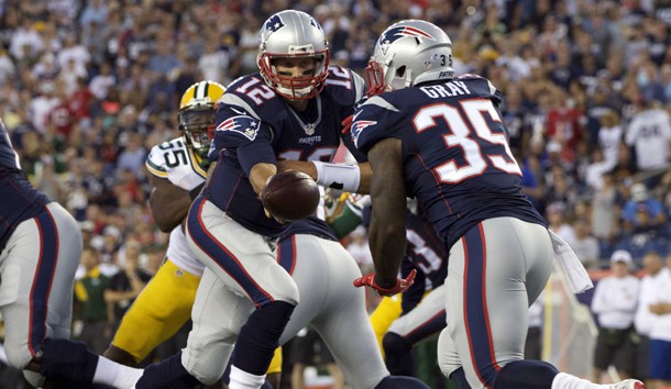 Aug 13, 2015; Foxborough, MA, USA; New England Patriots quarterback Tom Brady (12) hands off the ball to running back Jonas Gray (35) during the first quarter against the Green Bay Packers in a preseason NFL football game at Gillette Stadium. Mandatory Credit: David Butler II-USA TODAY Sports