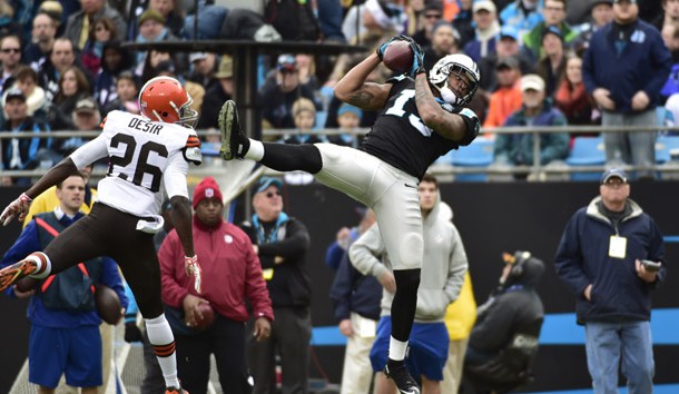 Dec 21, 2014; Charlotte, NC, USA; Carolina Panthers wide receiver Kelvin Benjamin (13) catches a pass as Cleveland Browns cornerback Pierre Desir (26) defends in the second quarter at Bank of America Stadium. (Bob Donnan-USA TODAY Sports)