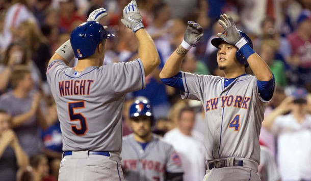 Aug 24, 2015; Philadelphia, PA, USA; New York Mets shortstop Wilmer Flores (4) high fives third baseman David Wright (5) after hitting a two RBI home run during the fourth inning against the Philadelphia Phillies at Citizens Bank Park. Mandatory Credit: Bill Streicher-USA TODAY Sports