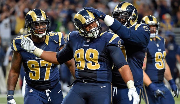 Sep 13, 2015; St. Louis, MO, USA; St. Louis Rams defensive tackle Aaron Donald (99) celebrates with teammates after sacking Seattle Seahawks quarterback Russell Wilson (not pictured) during the second half at the Edward Jones Dome. Mandatory Credit: Jasen Vinlove-USA TODAY Sports