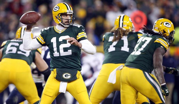 Nov 30, 2014; Green Bay, WI, USA; Green Bay Packers quarterback Aaron Rodgers (12) passes the ball during the second half against the New England Patriots at Lambeau Field. The Packers won 26-21. Mandatory Credit: Chris Humphreys-USA TODAY Sports