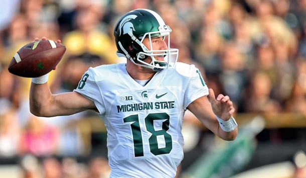 Sep 4, 2015; Kalamazoo, MI, USA; Michigan State Spartans quarterback Connor Cook (18) attempts to throw the ball against the Western Michigan Broncos prior to a game at Waldo Stadium. Mandatory Credit: Mike Carter-USA TODAY Sports
