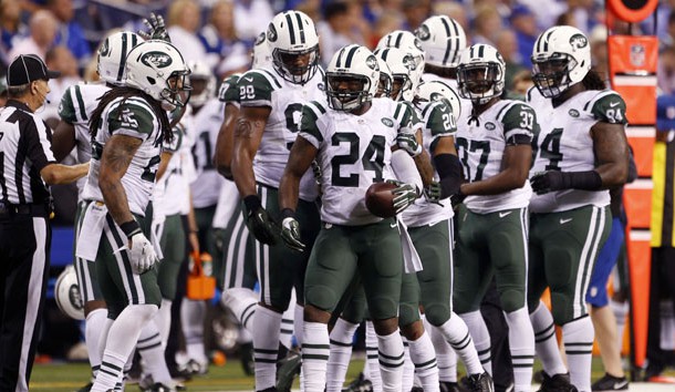 Sep 21, 2015; Indianapolis, IN, USA; New York Jets cornerback Darrelle Revis (24) is congratulated by his teammates after making an interception against the Indianapolis Colts at Lucas Oil Stadium. New York Jets defeat the Indianapolis Colts 20-7. Mandatory Credit: Brian Spurlock-USA TODAY Sports