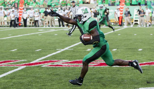 Sep 6, 2015; Huntington, WV, USA; Marshall Thundering Herd defensive back Keith Baxter (5) intercepts a pass late in the fourth quarter against the Purdue Boilermakers at Joan C. Edwards Stadium. Marshall won the game 41-31. Mandatory Credit: Ben Queen-USA TODAY Sports