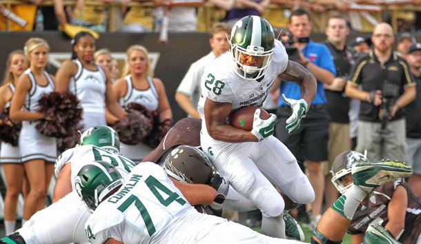 Sep 4, 2015; Kalamazoo, MI, USA; Michigan State Spartans running back Madre London (28) runs the ball  against the Western Michigan Broncos prior to a game at Waldo Stadium. Mandatory Credit: Mike Carter-USA TODAY Sports