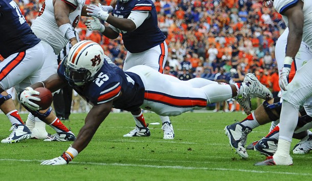 Sep 12, 2015; Auburn, AL, USA; Auburn Tigers running back Peyton Barber (25) scores the game-winning touchdown during overtime against the Jacksonville State Gamecocks at Jordan Hare Stadium. Auburn won 27-20. Mandatory Credit: Shanna Lockwood-USA TODAY Sports