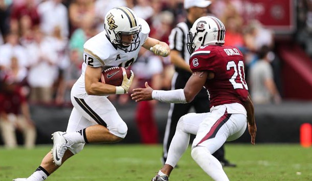 Sep 26, 2015; Columbia, SC, USA; UCF Knights wide receiver Blake Tiralosi (12) makes a catch and is stopped by South Carolina Gamecocks safety T.J. Gurley (20) during the second half at Williams-Brice Stadium. Mandatory Credit: Jim Dedmon-USA TODAY Sports