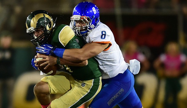 Oct 10, 2015; Fort Collins, CO, USA; Colorado State quarterback Nick Stevens (left)  is sacked by Boise State Broncos defensive lineman Kamalei Correa (8) during the college football game at Hughes Stadium.  Mandatory Credit: Austin Humphreys/The Coloradoan via USA TODAY Sports