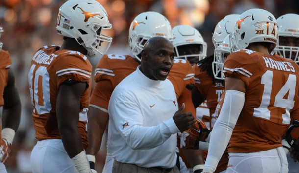 Sep 12, 2015; Austin, TX, USA; Texas Longhorns head coach Charlie Strong (center) talks to his team against the Rice Owls during the first quarter at Darrell K Royal-Texas Memorial Stadium. Mandatory Credit: Brendan Maloney-USA TODAY Sports