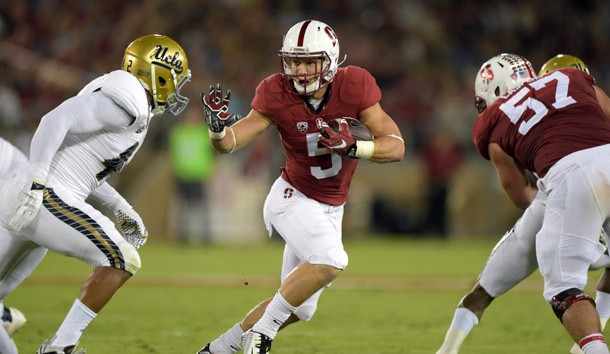 Oct 15, 2015; Stanford, CA, USA; Stanford Cardinal running back Christian McCaffrey (5) is defended by UCLA Bruins linebacker Kenny Young (42) in a NCAA football game at Stanford Stadium. Mandatory Credit: Kirby Lee-USA TODAY Sports