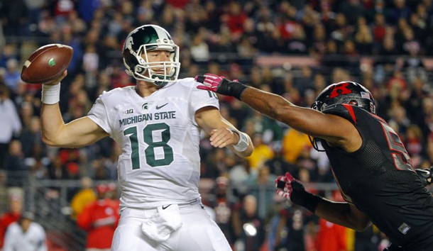 Oct 10, 2015; Piscataway, NJ, USA; Rutgers Scarlet Knights linebacker Quentin Gause (50) puts pressure on Michigan State Spartans quarterback Connor Cook (18) during the second quarter at High Points Solutions Stadium. Mandatory Credit: Jim O'Connor-USA TODAY Sports