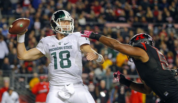 Oct 10, 2015; Piscataway, NJ, USA;  Rutgers Scarlet Knights linebacker Quentin Gause (50) puts pressure on Michigan State Spartans quarterback Connor Cook (18) during the second quarter at High Points Solutions Stadium. Mandatory Credit: Jim O'Connor-USA TODAY Sports