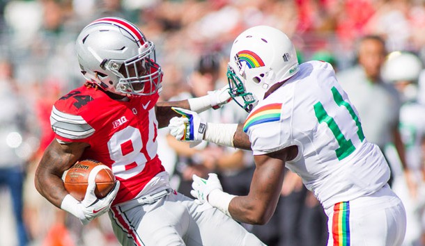 Sep 12, 2015; Columbus, OH, USA; Ohio State Buckeyes wide receiver Corey Smith (84) avoids a tackle during the game against the Hawaii Warriors at Ohio Stadium. The Ohio State Buckeyes beat the Hawaii Warriors by the score of 38-0. Mandatory Credit: Trevor Ruszkowski-USA TODAY Sports