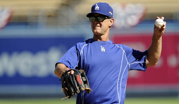 October 8, 2015; Los Angeles, CA, USA; Los Angeles Dodgers manager Don Mattingly (8) throws during workouts before game one of the NLDS at Dodger Stadium. Mandatory Credit: Gary A. Vasquez-USA TODAY Sports