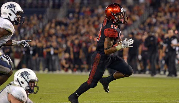 Oct 23, 2015; San Diego, CA, USA; San Diego State Aztecs running back Donnel Pumphrey (19) carries the ball to score a touchdown during the second quarter against the Utah State Aggies at Qualcomm Stadium. Mandatory Credit: Jake Roth-USA TODAY Sports